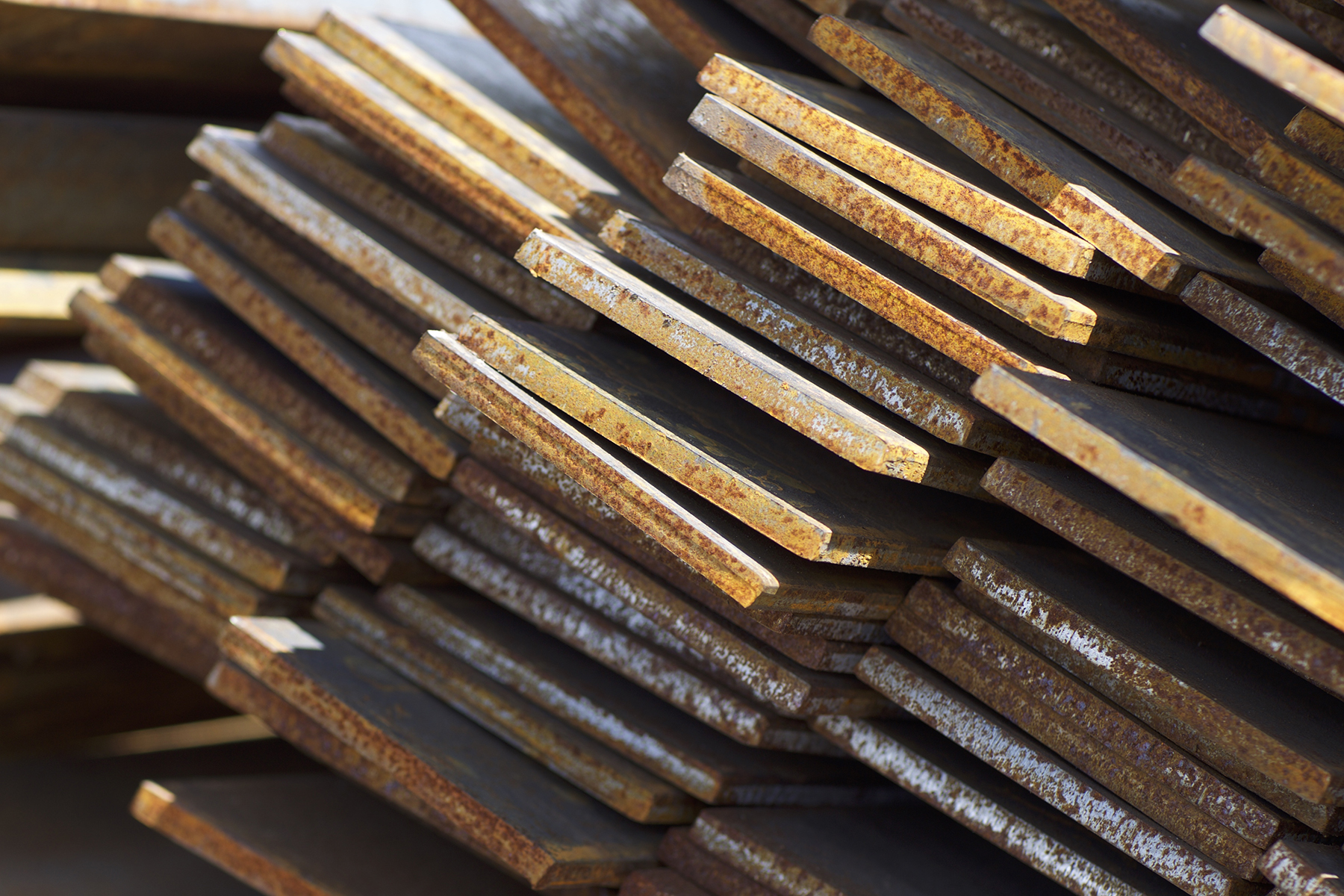 Stacked pile of profile clad metal strip